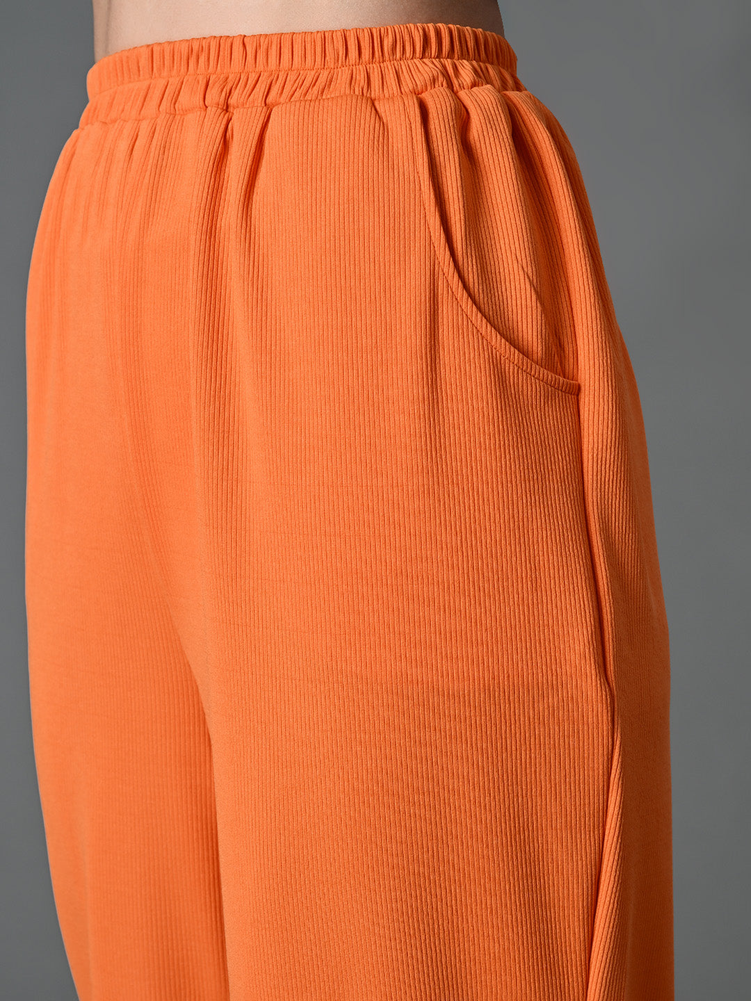 Myshka Women's Solid Ribbed High-Rise Wide Leg Casual Trousers in Orange Color
