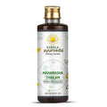 A bottle of Mahamasha Thailam herbal massage oil by Kerala Ayurveda, with product information and branding visible on the label.