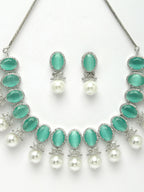 NVR Women's Silver-Plated Green American Diamond Studded Handcrafted Jewellery Set