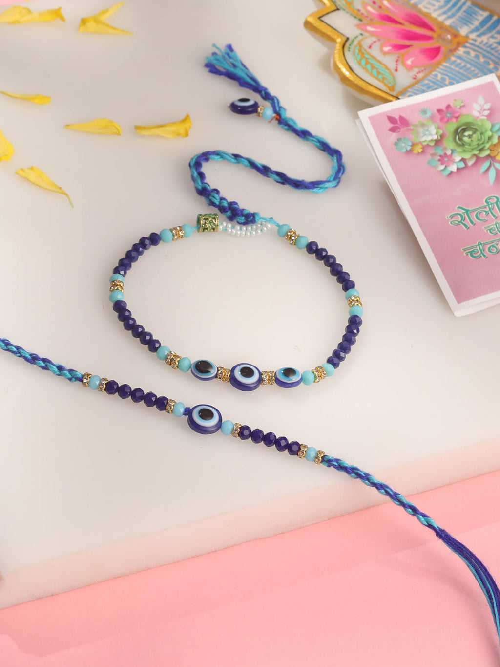 NVR Set of 2 Blue Evil Eye Artificial Beads Bhaiya Bhabhi Rakhi with Roli Chawal Chandan & Mishri - Distacart