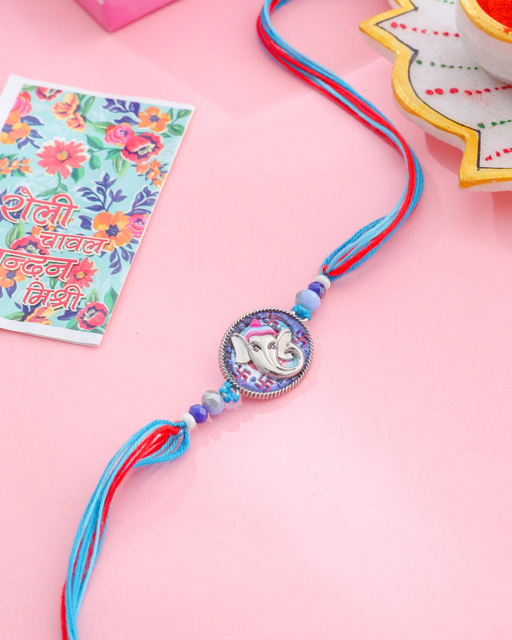 NVR Men Red & Blue Ganesh Ji Thread Rakhi with Roli Chawal Chandan & Mishri - Distacart