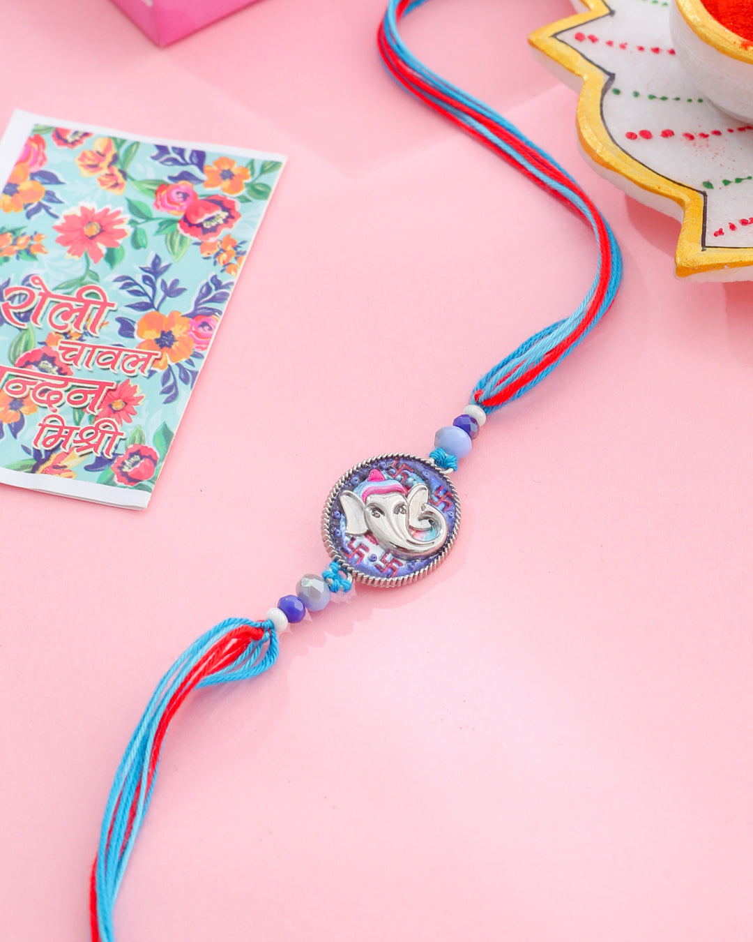 NVR Men Red & Blue Ganesh Ji Thread Rakhi with Roli Chawal Chandan & Mishri - Distacart