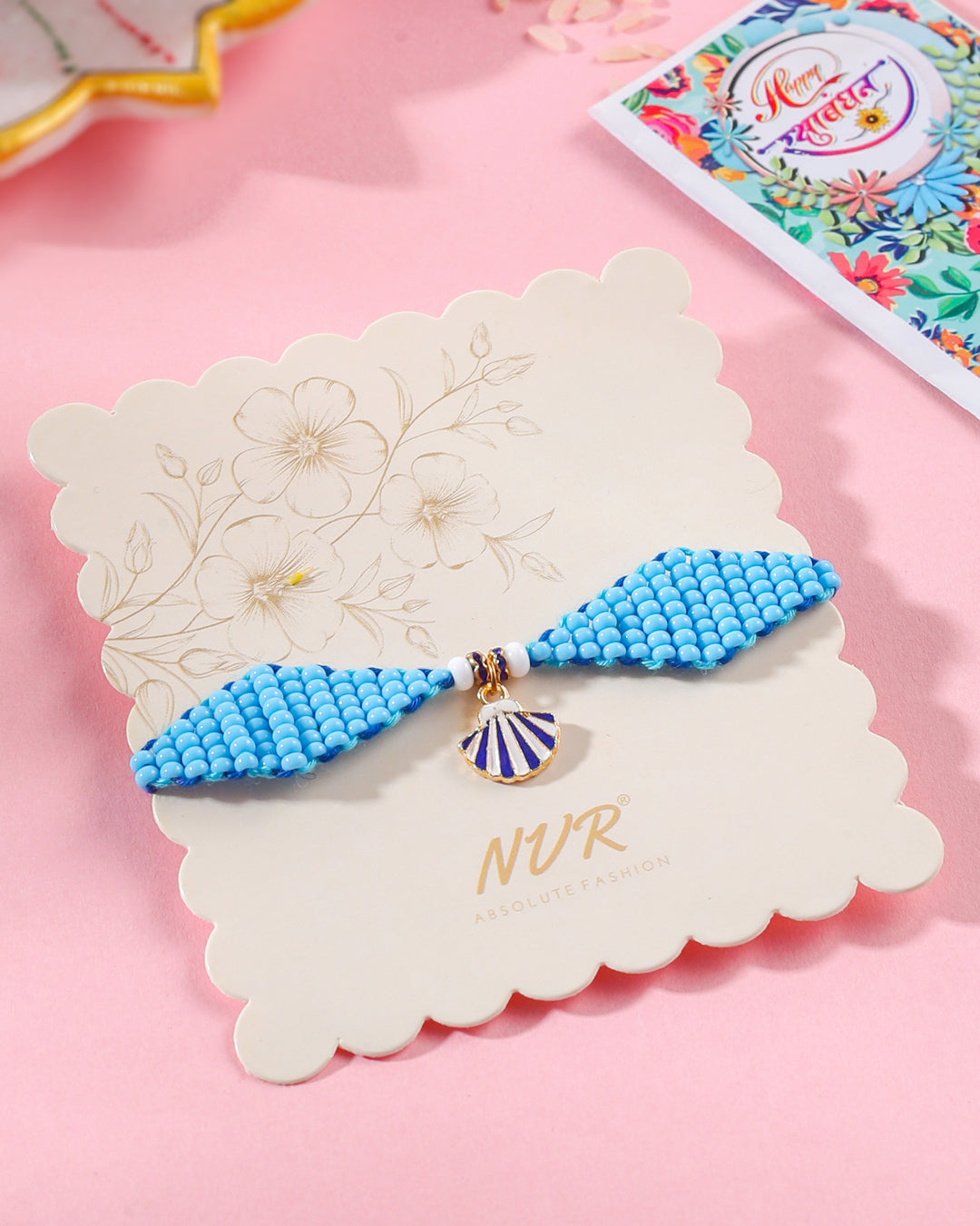 NVR Men Blue Pearls Unique Design Thread Rakhi with Roli Chawal Chandan & Mishri - Distacart