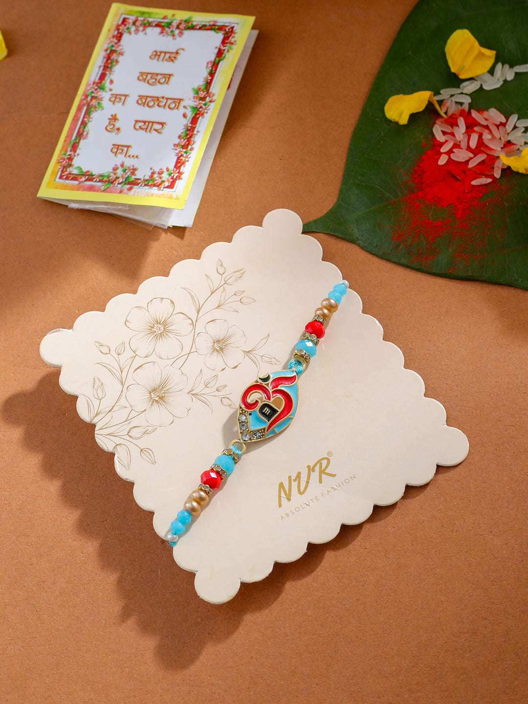 NVR Men Red & Blue Artificial Stones and Beads Om Thread Rakhi with Roli Chawal Chandan & Mishri - Distacart
