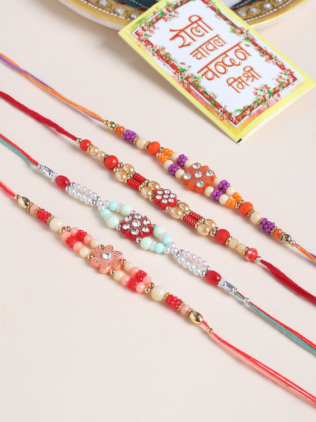 NVR Men Set of 4 Floral Design Multicolor Artificial Stones and Beads Thread Rakhi with Roli Chawal Chandan & Mishri - Distacart