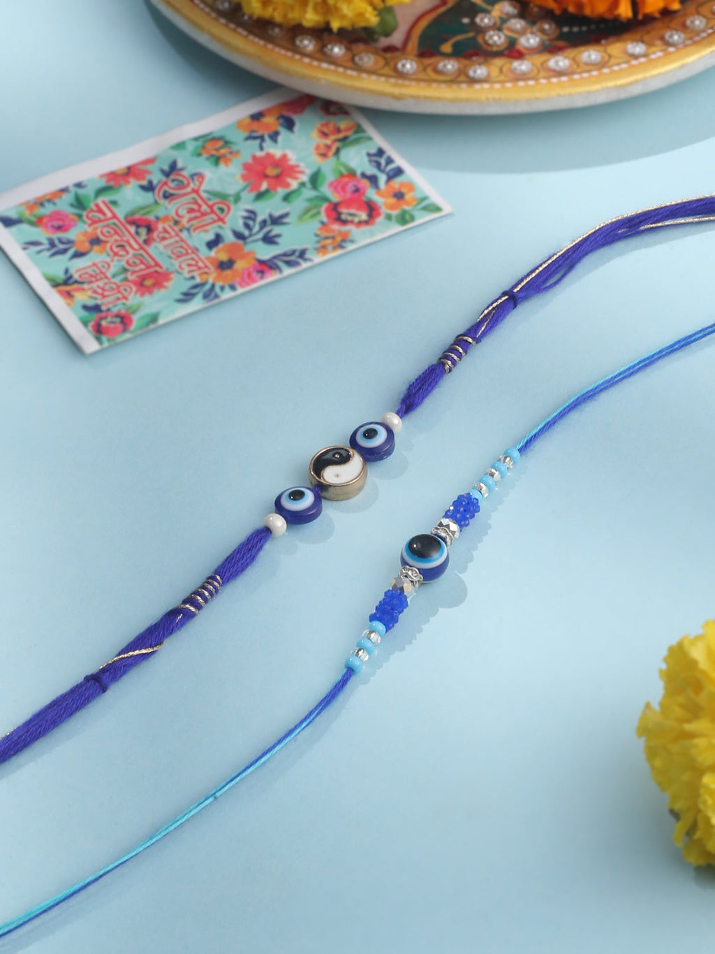 NVR Men Set of 2 Blue Evil Eye Artificial Beads Thread Rakhi with Roli Chawal Chandan & Mishri - Distacart