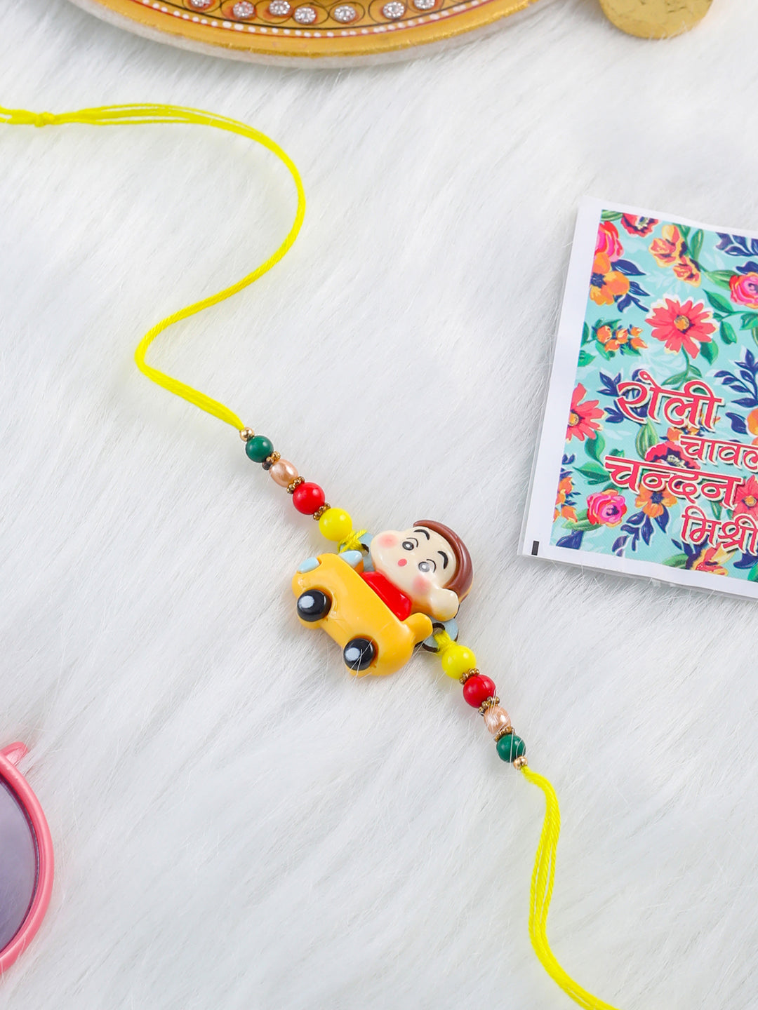 NVR Kids Yellow Cartoon Artificial Beads Rakhi with Roli Chawal Chandan & Mishri - Distacart