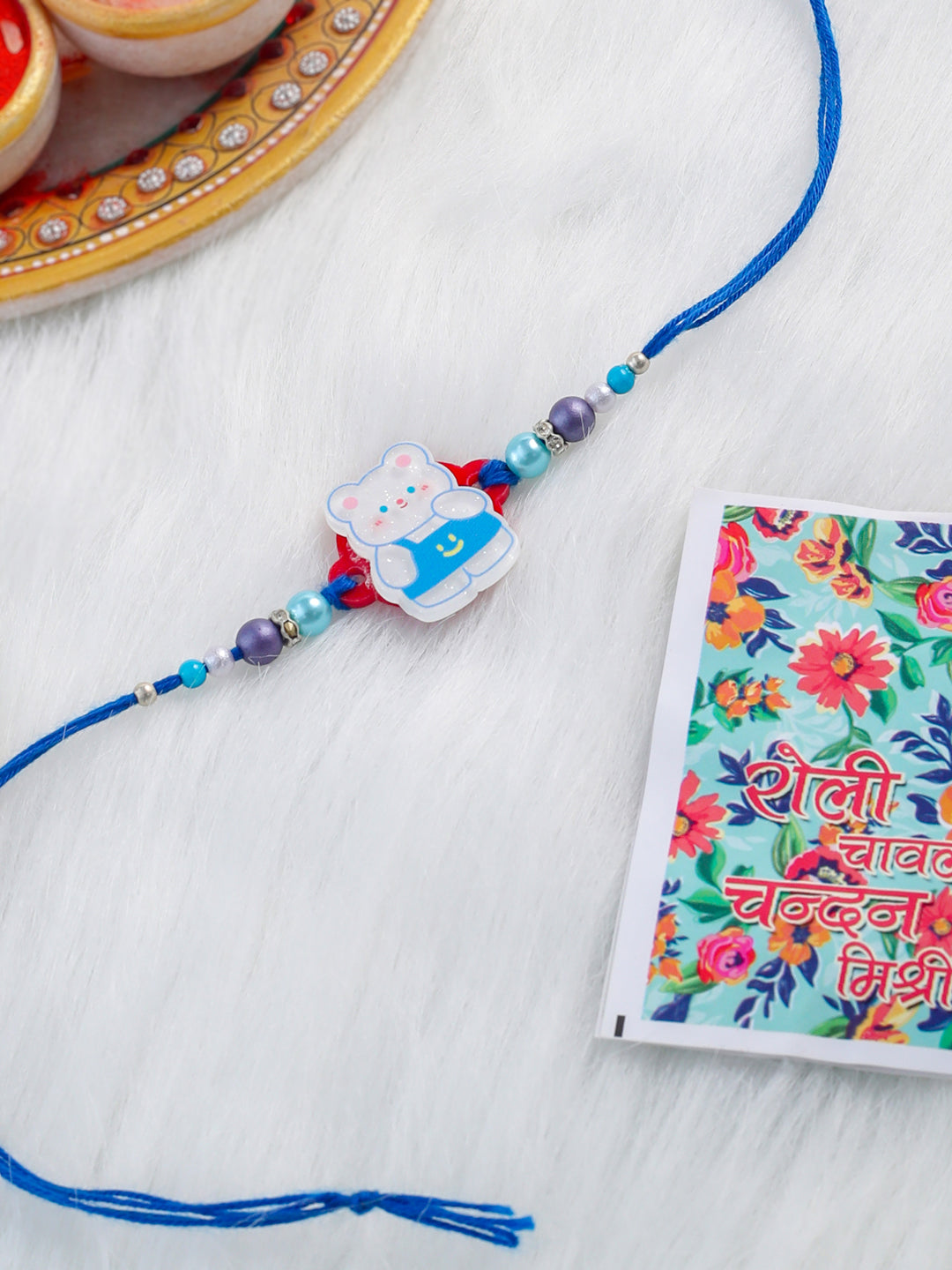NVR Kids Teddy Blue Artificial Beads Thread Rakhi with Roli Chawal Chandan & Mishri - Distacart