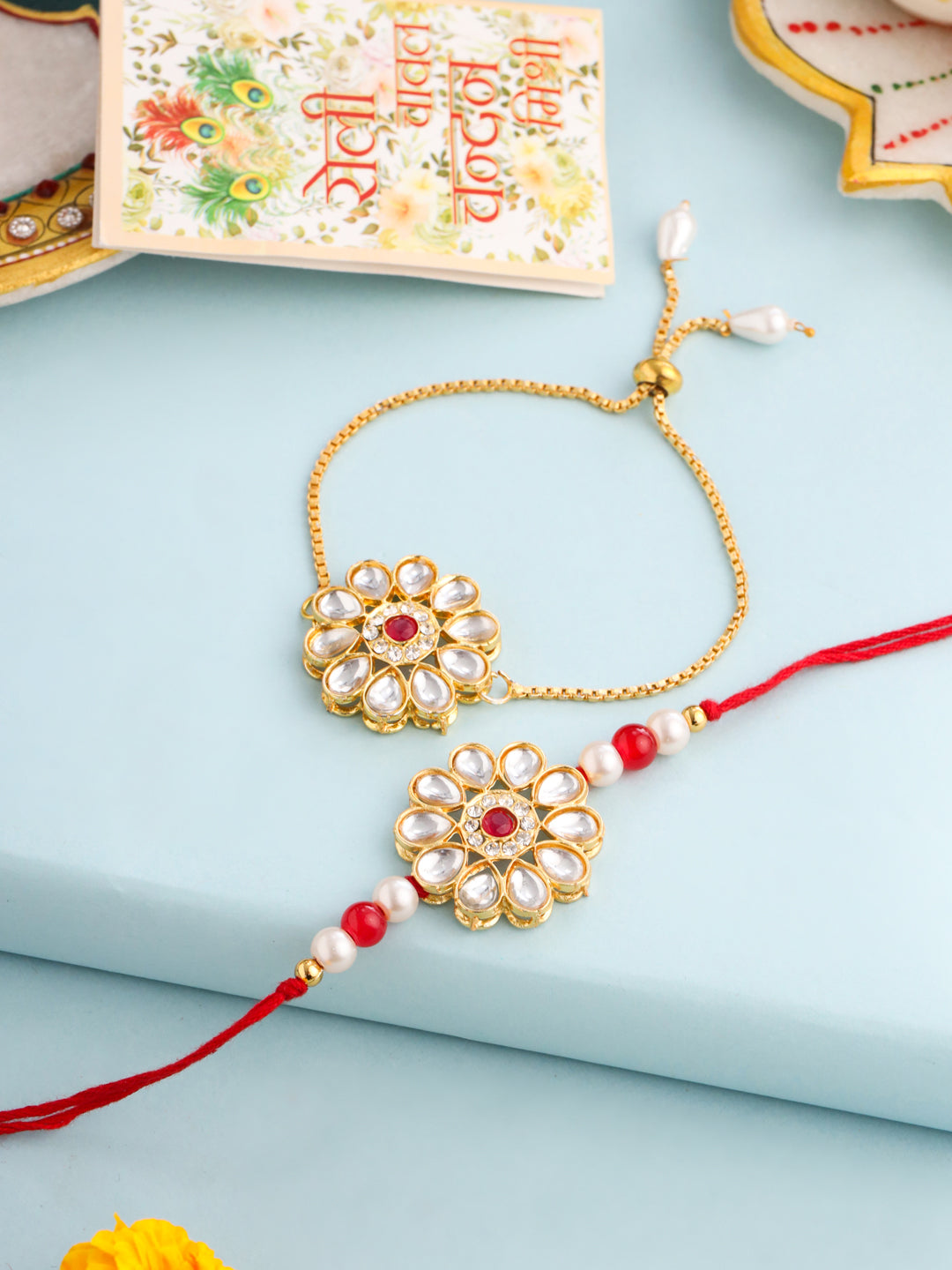 NVR Set of 2 Gold Toned Kundan Studded Floral Design Bhaiya Bhabhi Rakhi Set with Roli Chawal Chandan & Mishri - Distacart