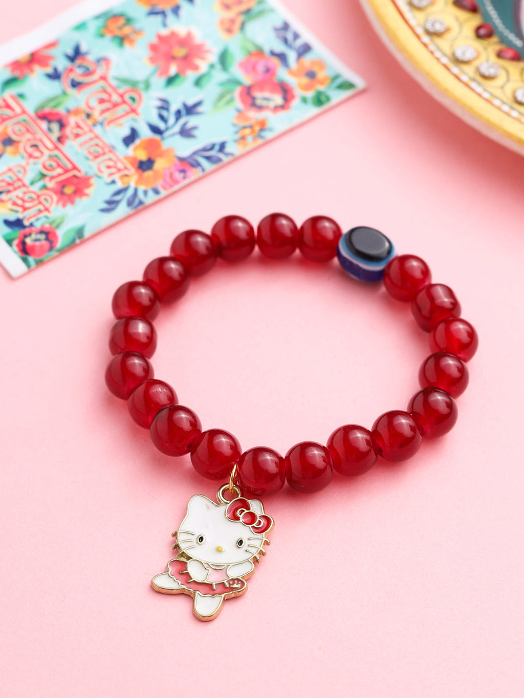 NVR Kids Cartoon Design Maroon Artificial Beads Thread Rakhi with Roli Chawal Chandan & Mishri - Distacart
