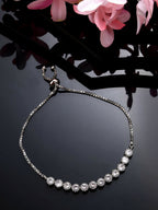 NVR Women Silver-Plated American Diamond Studded Rakhi With Roli Chawal - Distacart