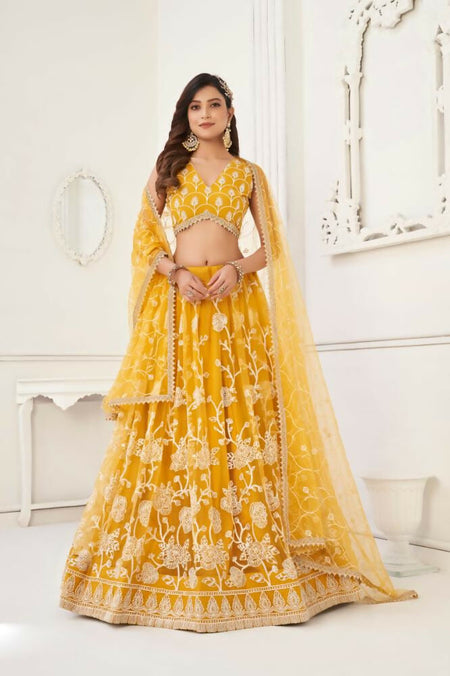 Aastha Fashion Mustard Yellow Butterfly Net White Cotton Thread Work And Sequence Work Embroidery Wedding Wear Lehenga Choli