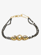 Black Gold-Toned Kundan Bracelet Mangalsutra - Ruby Raang - Distacart