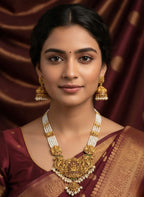 Jewel City Antique Gold-Plated Temple Lakshmi Haram Necklace Set with White Beads & Jhumka Earrings
