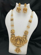 Jewel City Antique Gold-Plated Temple Lakshmi Haram Necklace Set with White Beads & Jhumka Earrings