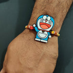 Indianvibez Doraemon Wooden Rakhi with Rudraksha, Cartoon Rakhi for Bro, Shop India - Kids Rakhi