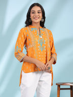Juniper Mustard Rayon Ikat Placement Printed High-Low Tunic With Side Slits & Tassels