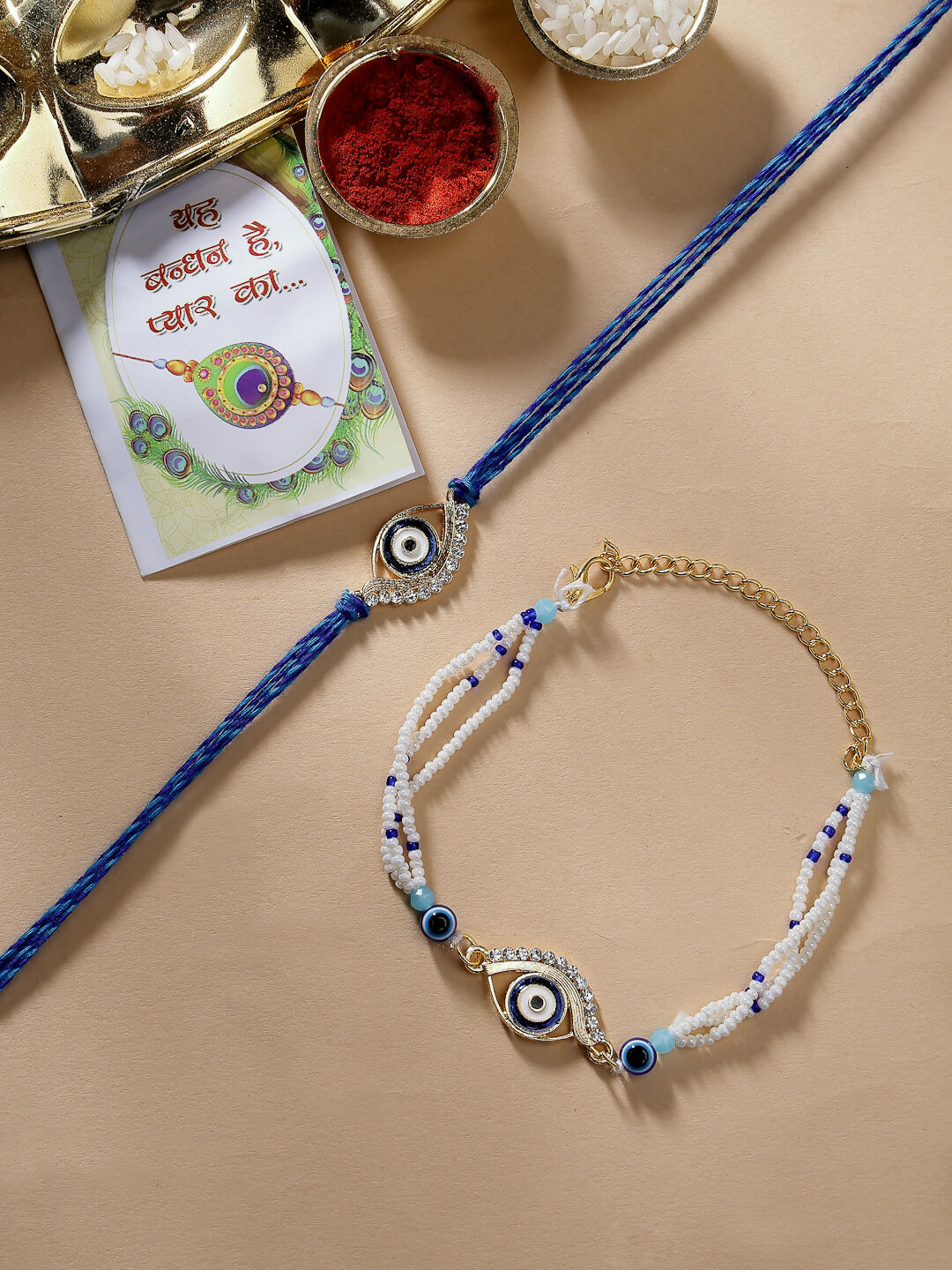 NVR Women & Men Set of 2 Blue Evil Eye Bhaiya Bhabhi Rakhi Set With Roli Chawal & Chocolate - Distacart