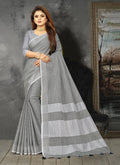 Shree Shyam Fashion Elegant Light Grey Woven Linen Saree with Contrast Zari Border & Tassels - Soft & Breathable Party Wear - Distacart
