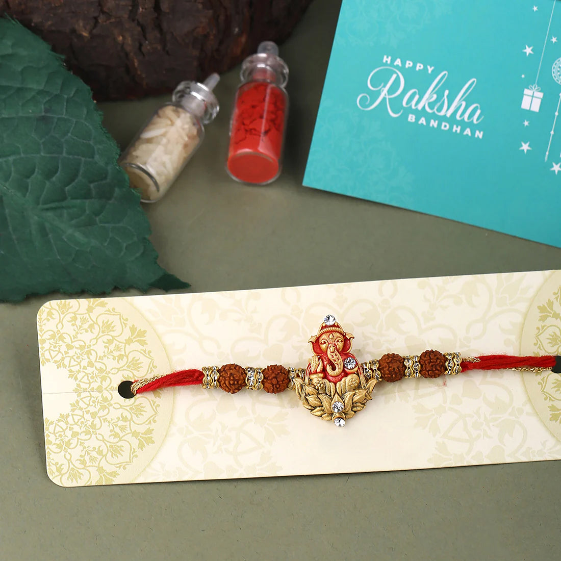 trueBrowns X Voylla Divine Rudraksha Ganesha Rakhi With Roli Chaawal Pack - Distacart
