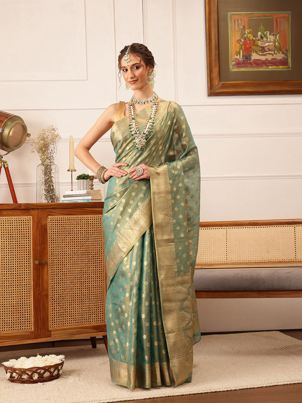 Hiral Fashion Teal Kanjivaram Tissue Silk Floral Zari Woven Saree