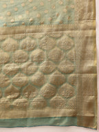 Hiral Fashion Teal Kanjivaram Tissue Silk Floral Zari Woven Saree
