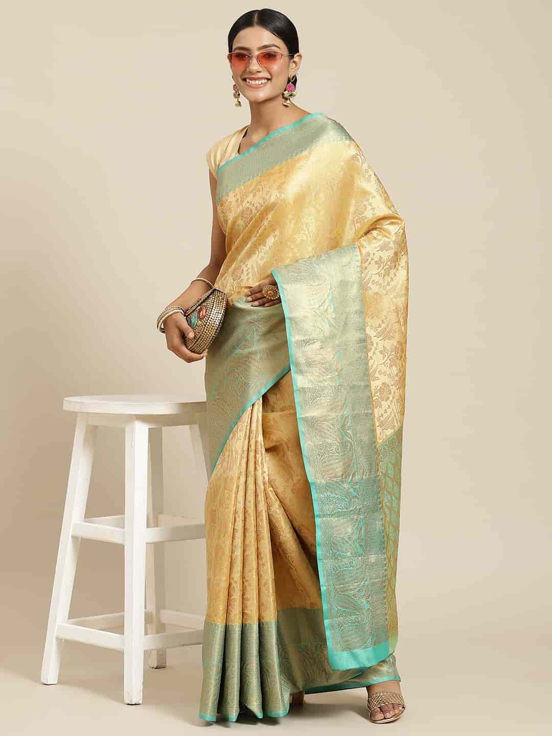 Hiral Fashion Beige Kanjeevaram Art Silk Floral Woven Design Saree