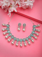 NVR Women's Silver-Plated Green American Diamond Studded Handcrafted Jewellery Set