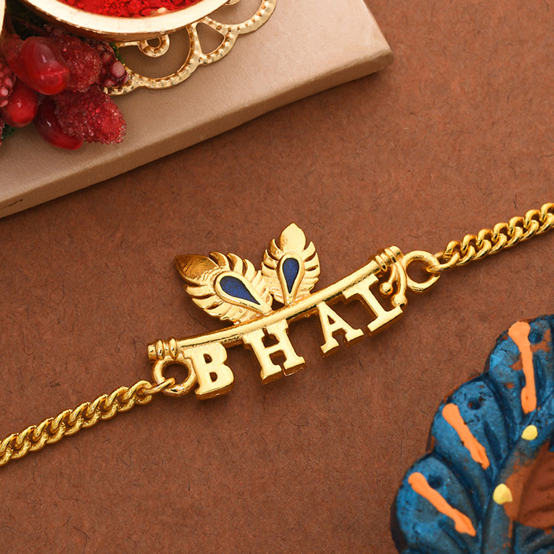 trueBrowns Peacock Feather Motif Gold Tone Bhai Rakhi - Distacart