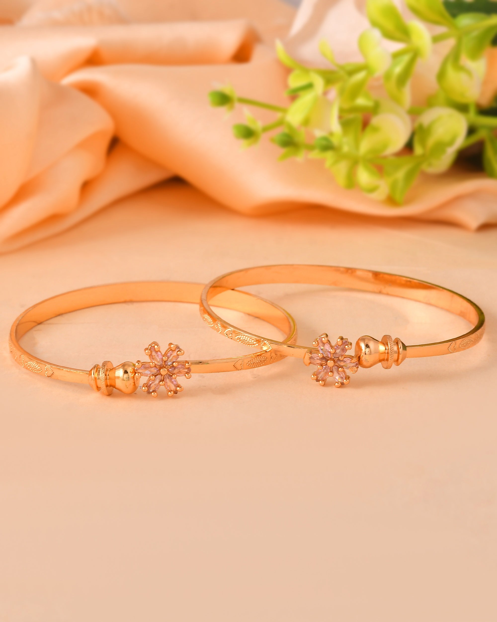 VOJ Set Of 2 Gold Polished Pink Stone Studded Floral Shaped Bangles
