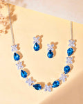VOJ Silver Plated Blue And White Stone Studded Necklace with Earrings Set