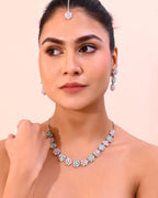 VOJ Silver Plated AD With Nude Green And Light Pink Flower Jewellery Set With Mangtikka