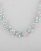 VOJ Silver Plated AD With Nude Green And Light Pink Flower Jewellery Set With Mangtikka