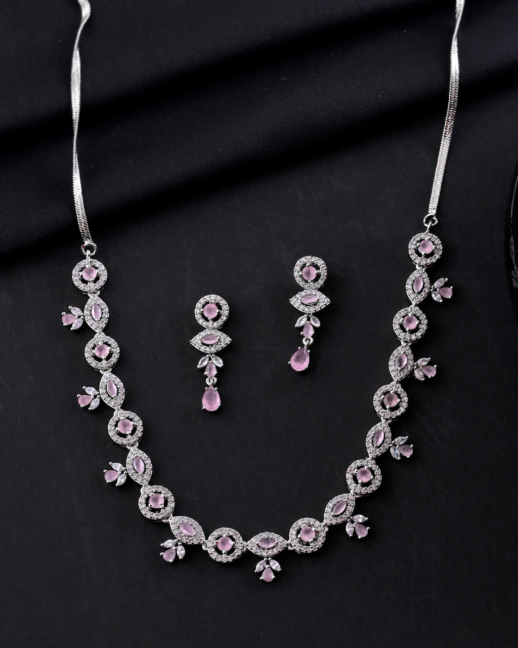 VOJ Silver Toned White And Baby Pink Stone Studded AD Jewellery Set
