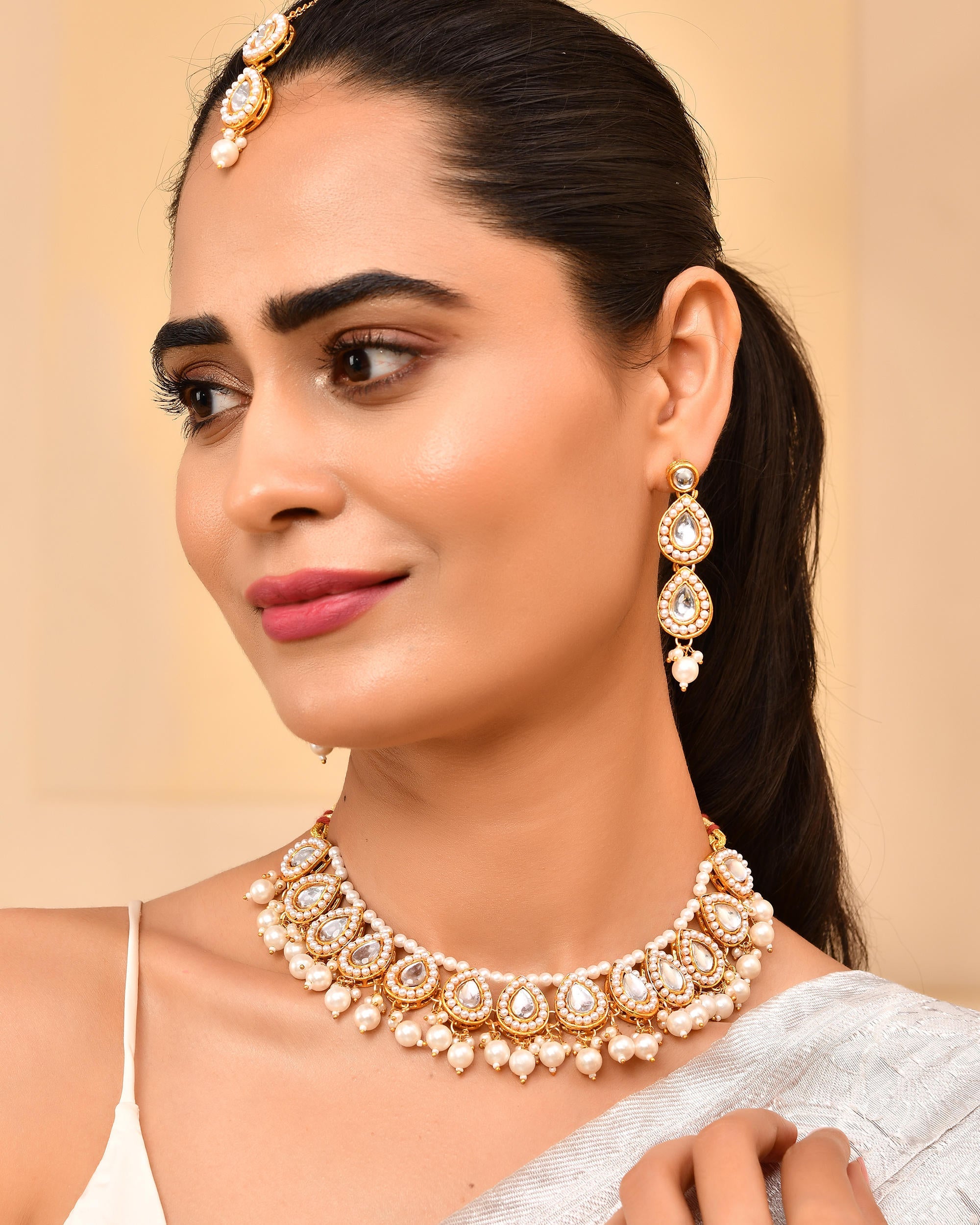 VOJ Gold-Polished Kundan Stones Studded Jewellery Set With Maang Tikka