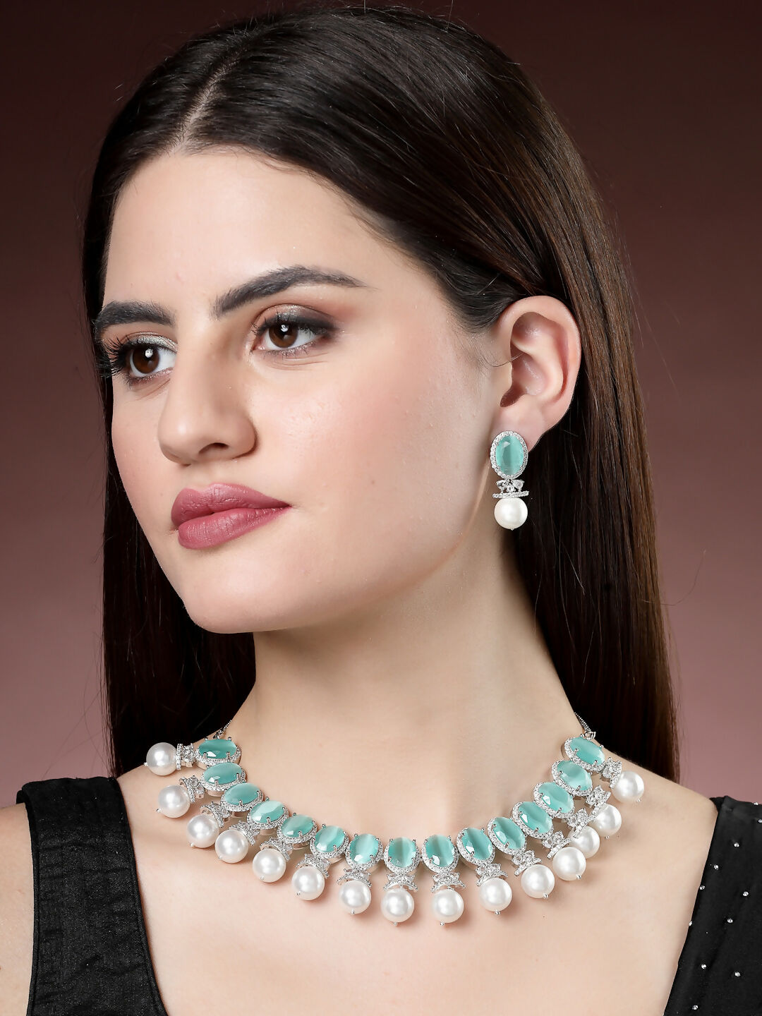 NVR Women's Silver-Plated Green American Diamond Studded Handcrafted Jewellery Set