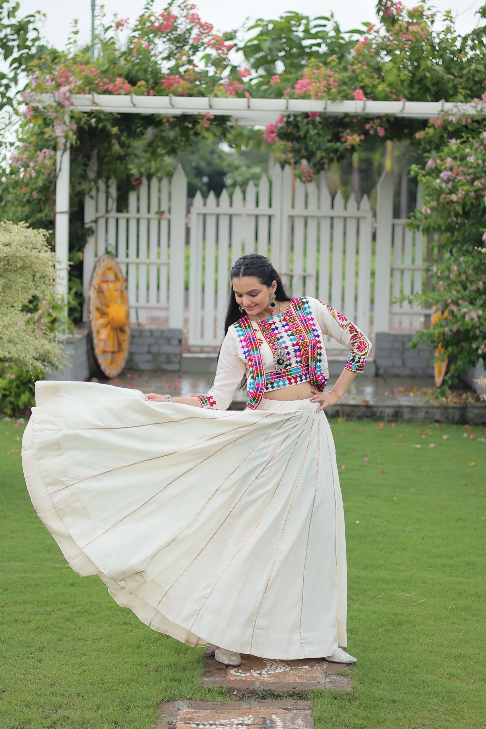 Evanik Navratri Off White Roamn Fabric With Kutchi Work Koti Style Blouse Stitched Lehenga Choli