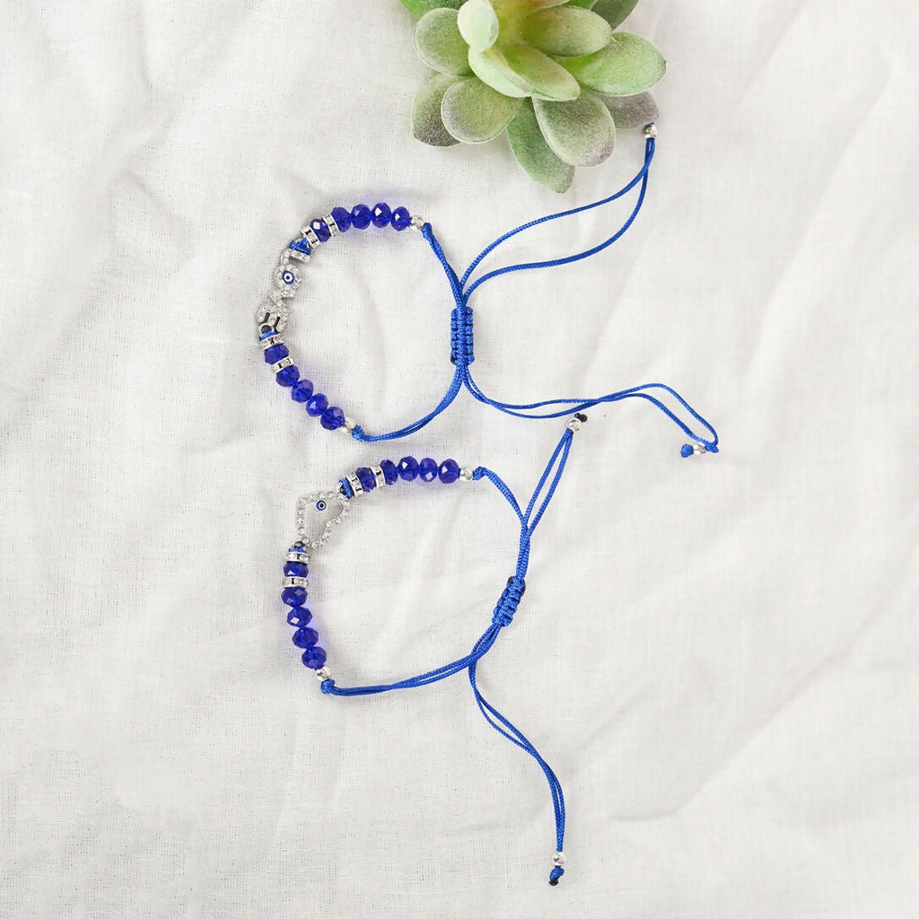 NVR Women & Men Set of 2 Blue Evil Eye Rakhi With Roli Chawal - Distacart