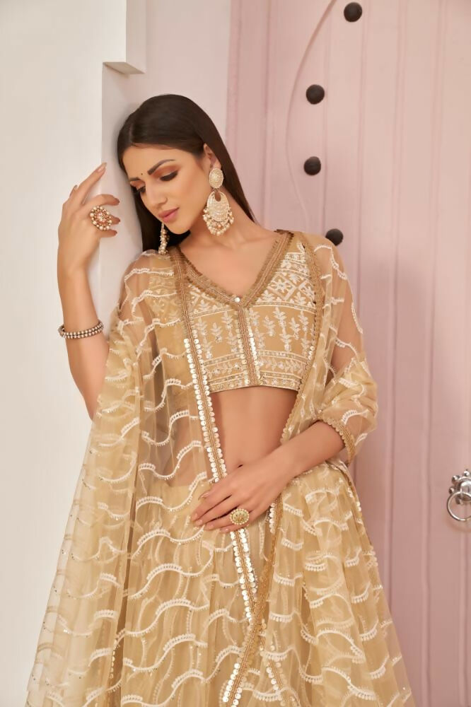 Aastha Fashion Beige Chiku Butterfly Net White Cotton Thread Work, Zari Work And Sandwich Sequence Work Embroidery Wedding Wear Lehenga Choli
