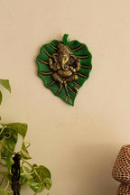 eCraftIndia Metal Golden Lord Ganesha On Green Leaf Wall Hanging Sculpture