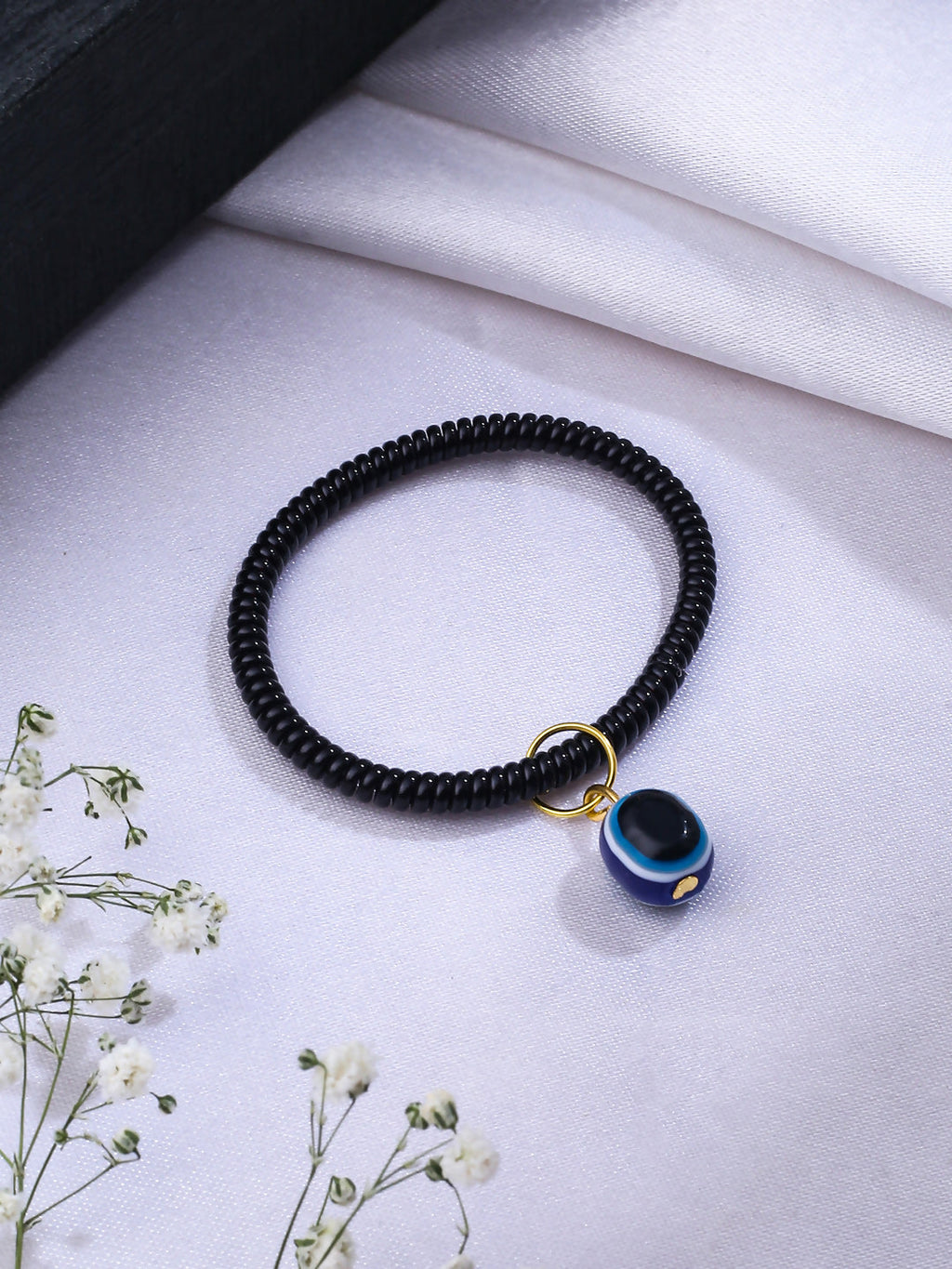 NVR Women & Men Black Evil Eye Spring Ring Rakhi With Roli Chawal - Distacart