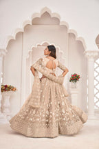 Aastha Fashion Dusty Chiku Butterfly Net White Cotton Thread Work, Zari Work And Sandwich Sequence Work Embroidery Wedding Wear Lehenga Choli
