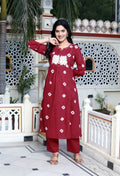 Miravan Women's Red Bandhani Printed Moti And Chikan Embroidered & Lace Work A Line Palazzo Set