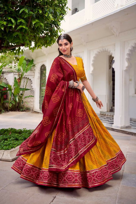 Evanik Yellow Tassa Silk With Bandhej Print Lehenga Choli