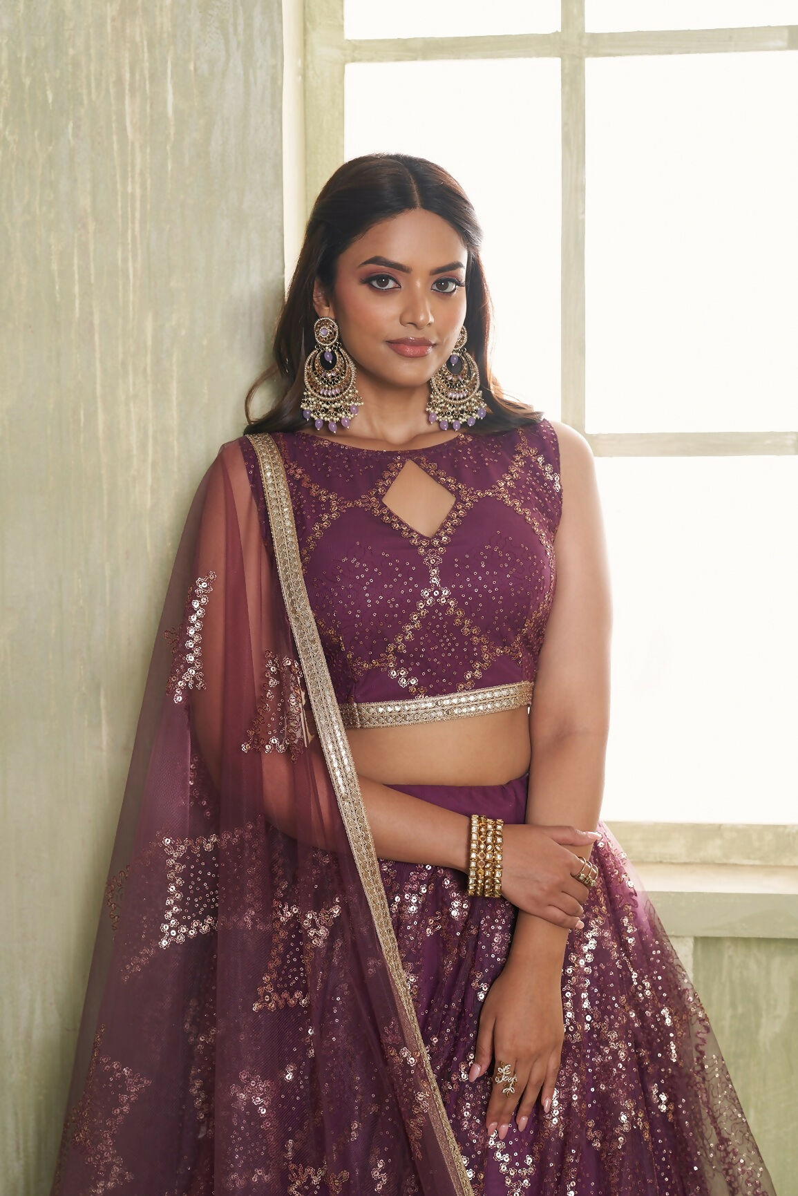 Eilara Embroidered, Sequins And Thread Work Net A - Line Lehenga Choli In Wine