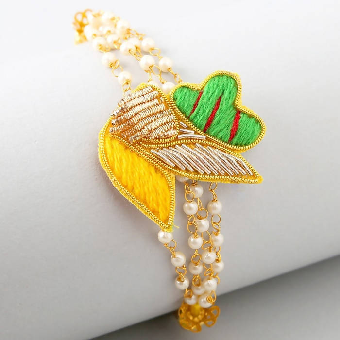 Meenakari Glimming Rakhi & Kaju Rolls Box - Distacart