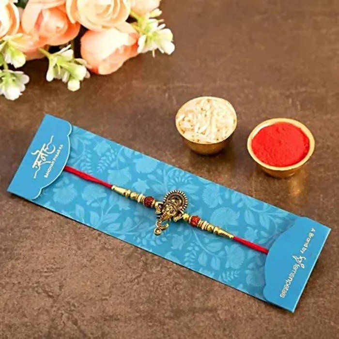 Lord Ganesha Rudraksha Rakhi & Kaju Roll Box - Distacart
