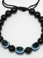 NVR Women & Men Black Evil Eye Rakhi With Roli Chawal - Distacart