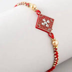 Sleek American Diamond Rakhi And Cashew Jar - Distacart