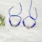 NVR Women & Men Set of 2 Blue Evil Eye Rakhi With Roli Chawal - Distacart
